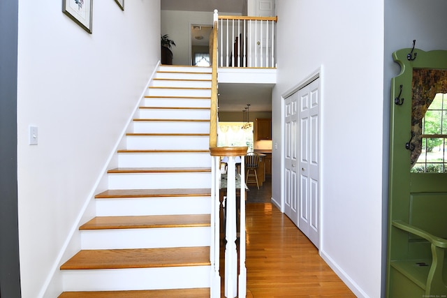 32 Sable Dr, Ledyard, CT 06339 - staircase featuring wood finished floors and a high ceiling