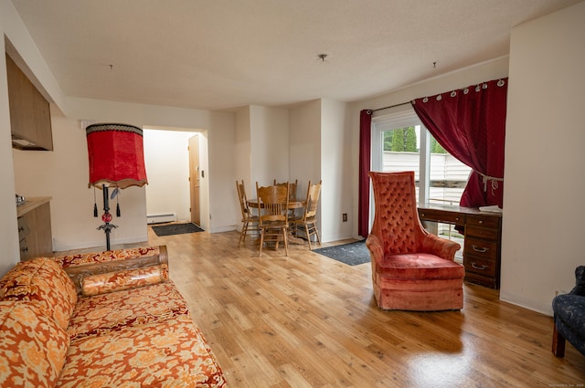 226 Laurel St Apt 4, East Haven, CT 06512 - living area featuring baseboard heating and wood finished floors