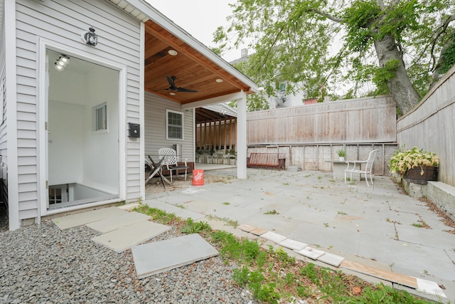 72 Harral Ave, Bridgeport, CT 06604 - fenced backyard with a ceiling fan and a patio area