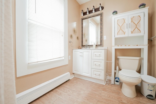 72 Harral Ave, Bridgeport, CT 06604 - bathroom with a baseboard radiator, vanity, and wood finished floors