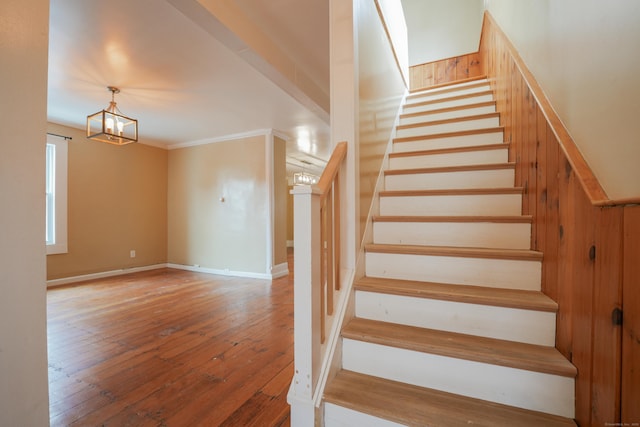 72 Harral Ave, Bridgeport, CT 06604 - stairs with a chandelier, wood-type flooring, and ornamental molding