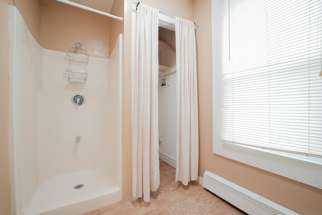 72 Harral Ave, Bridgeport, CT 06604 - full bath featuring baseboard heating, a shower with curtain, and wood finished floors