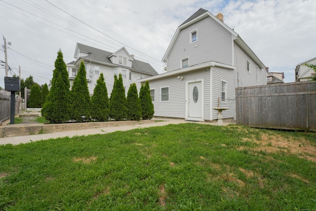 72 Harral Ave, Bridgeport, CT 06604 - back of house featuring a chimney