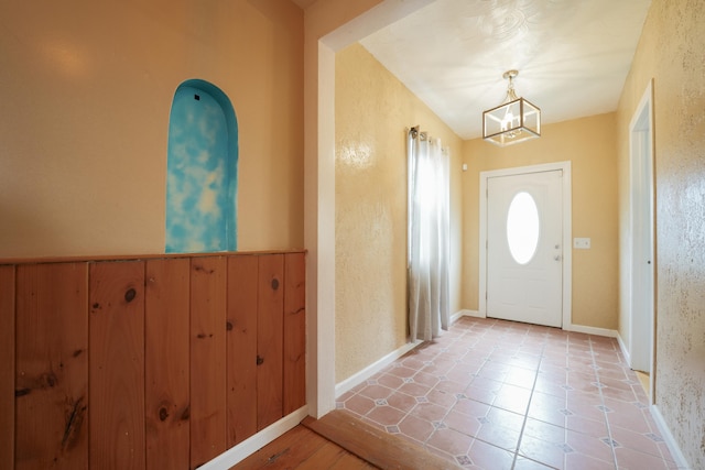 72 Harral Ave, Bridgeport, CT 06604 - tiled foyer with a chandelier and baseboards