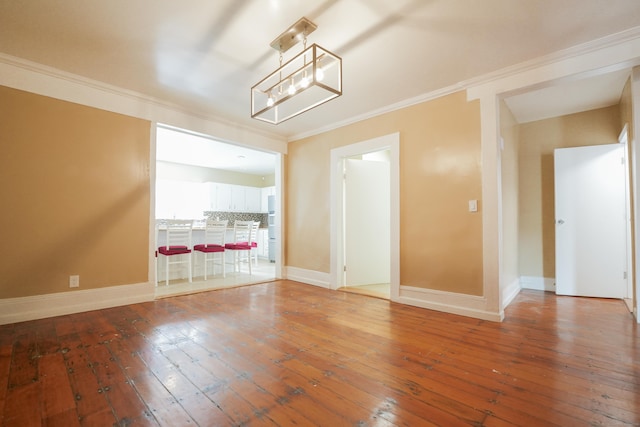 72 Harral Ave, Bridgeport, CT 06604 - unfurnished dining area with hardwood / wood-style floors and ornamental molding