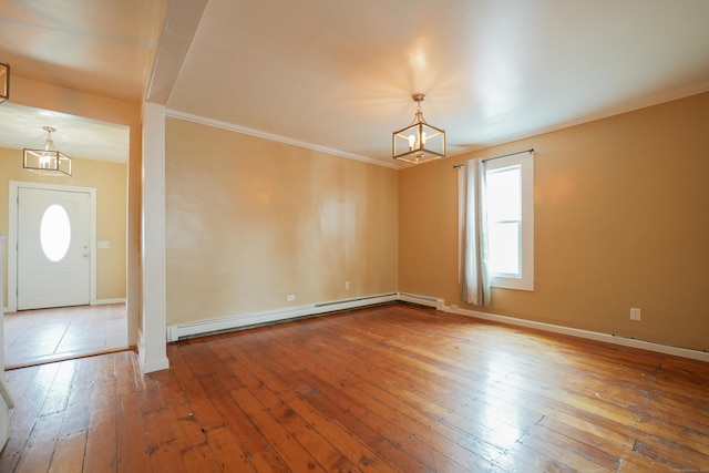 72 Harral Ave, Bridgeport, CT 06604 - spare room with a chandelier, a baseboard radiator, hardwood / wood-style floors, and crown molding