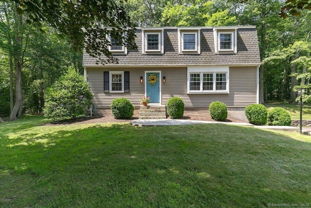 330 Foxwood Rd, Guilford, CT 06437 - view of front facade featuring roof with shingles, a front lawn, and entry steps
