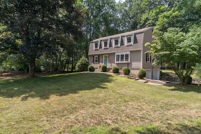330 Foxwood Rd, Guilford, CT 06437 - colonial inspired home featuring a gambrel roof, a garage, and a front lawn
