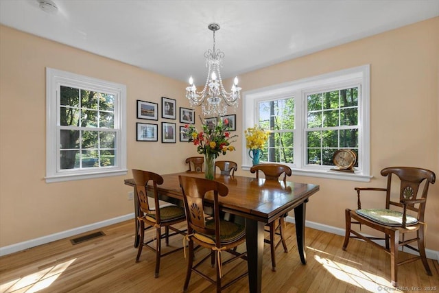 330 Foxwood Rd, Guilford, CT 06437 - dining space with a chandelier and light wood-type flooring