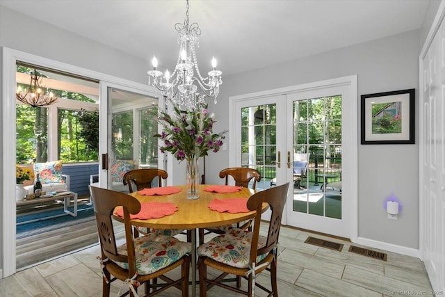330 Foxwood Rd, Guilford, CT 06437 - dining room with french doors and a chandelier