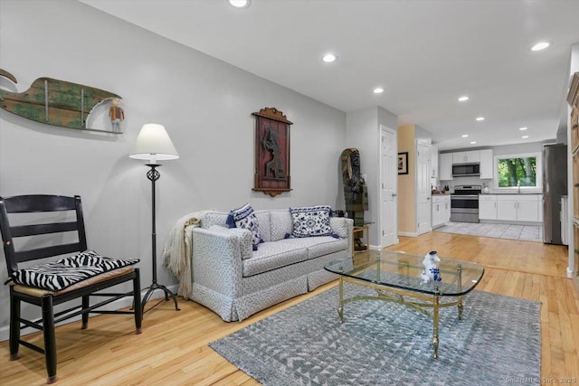 330 Foxwood Rd, Guilford, CT 06437 - living room with light wood finished floors and recessed lighting