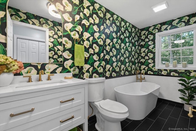330 Foxwood Rd, Guilford, CT 06437 - bathroom featuring wallpapered walls, a freestanding tub, vanity, and tile patterned floors