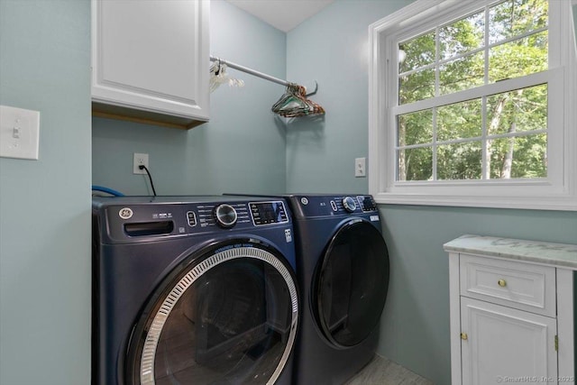 330 Foxwood Rd, Guilford, CT 06437 - laundry area featuring cabinet space, washing machine and dryer, and healthy amount of natural light