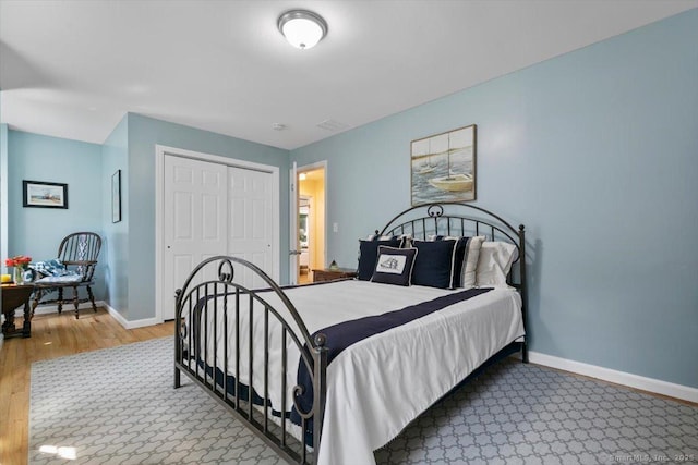 330 Foxwood Rd, Guilford, CT 06437 - bedroom featuring wood finished floors and a closet