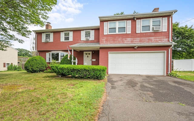 66 Claire St, Bristol, CT 06010 - view of front of home with a chimney, driveway, cooling unit, and a garage