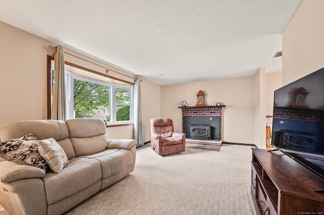 66 Claire St, Bristol, CT 06010 - living room with a wood stove and carpet flooring
