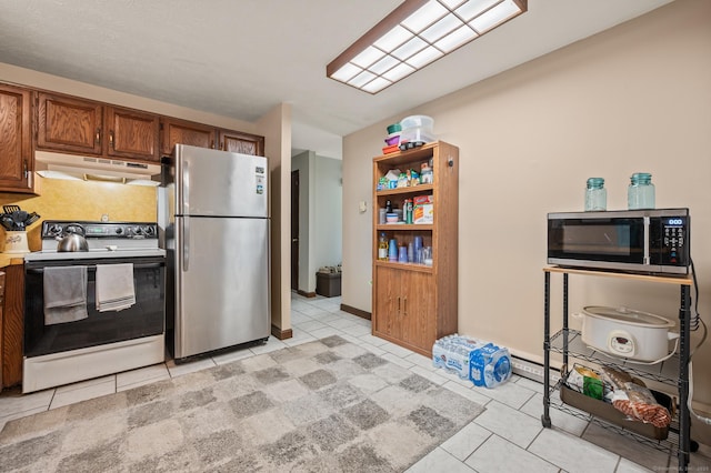 66 Claire St, Bristol, CT 06010 - kitchen with appliances with stainless steel finishes, under cabinet range hood, light tile patterned floors, brown cabinets, and light countertops