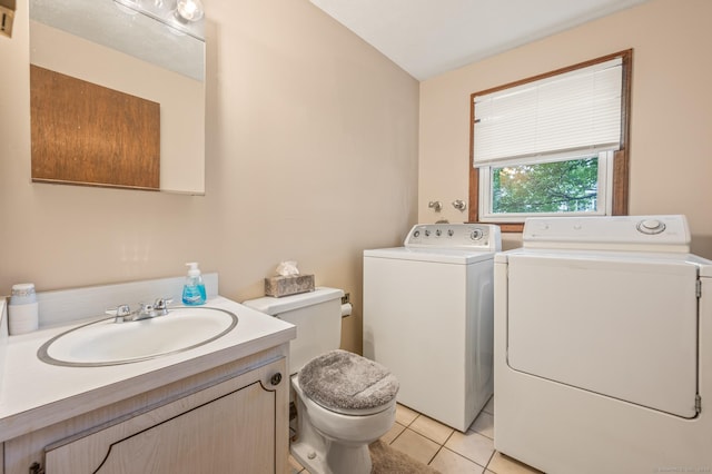 66 Claire St, Bristol, CT 06010 - bathroom with washer and dryer, vanity, and tile patterned flooring