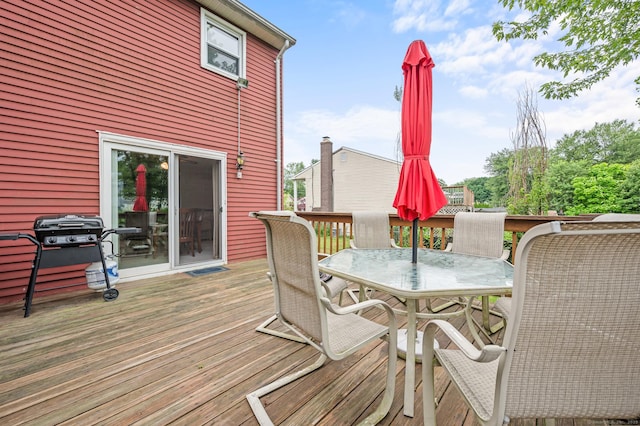 66 Claire St, Bristol, CT 06010 - wooden deck with a grill and outdoor dining space