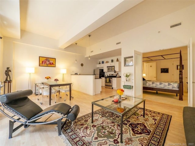 124 Court St Unit 8, New Haven, CT 06511 - living area featuring light wood-style floors and beam ceiling