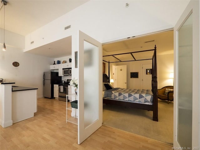 124 Court St Unit 8, New Haven, CT 06511 - bedroom featuring freestanding refrigerator and light wood-style flooring