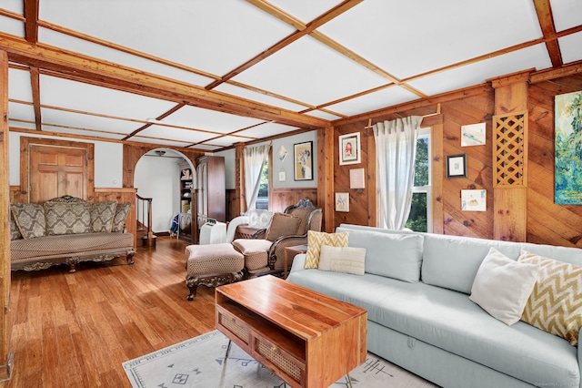 191 Farrell Rd, Waterbury, CT 06706 - living room with arched walkways, wooden walls, and wood finished floors