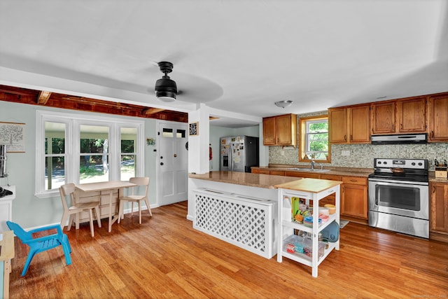 191 Farrell Rd, Waterbury, CT 06706 - kitchen with appliances with stainless steel finishes, extractor fan, brown cabinets, and light wood-style floors