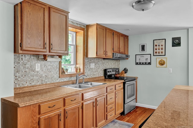 191 Farrell Rd, Waterbury, CT 06706 - kitchen featuring electric stove, wood finished floors, exhaust hood, tasteful backsplash, and light countertops