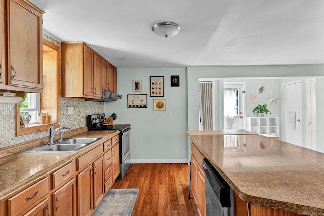191 Farrell Rd, Waterbury, CT 06706 - kitchen featuring stainless steel appliances, decorative backsplash, dark wood-style flooring, and brown cabinets