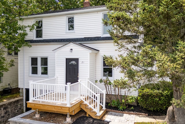 21 Whittlesey Ave, Waterbury, CT 06706 - view of front of house featuring a chimney and a shingled roof