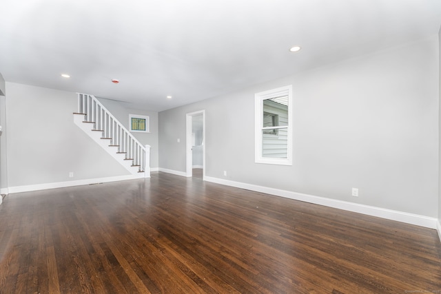 21 Whittlesey Ave, Waterbury, CT 06706 - unfurnished living room with stairway, recessed lighting, and dark wood-style floors
