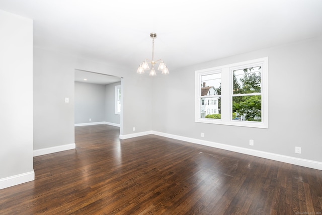21 Whittlesey Ave, Waterbury, CT 06706 - spare room featuring plenty of natural light, a chandelier, and dark wood-type flooring