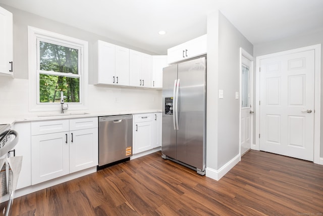 21 Whittlesey Ave, Waterbury, CT 06706 - kitchen featuring stainless steel appliances, dark wood-type flooring, light countertops, white cabinets, and backsplash