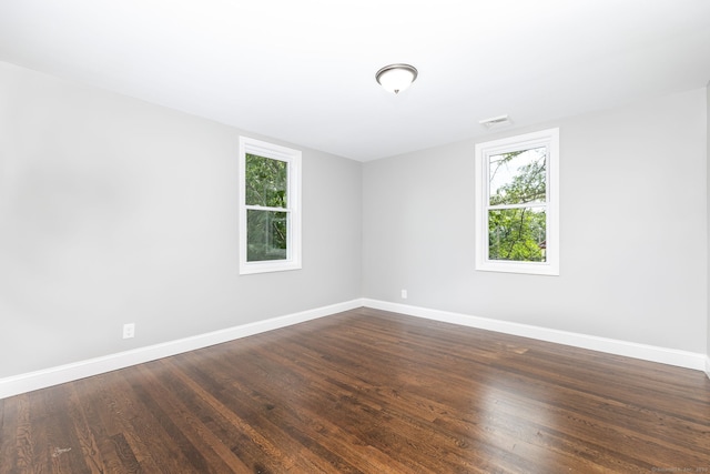 21 Whittlesey Ave, Waterbury, CT 06706 - unfurnished room with healthy amount of natural light and dark wood-style floors