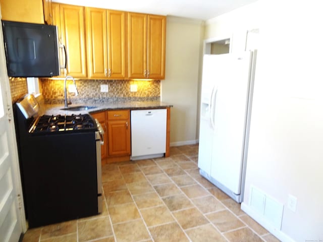 155 Sylvan Knoll Rd, Stamford, CT 06902 - kitchen with white appliances, tasteful backsplash, and dark countertops