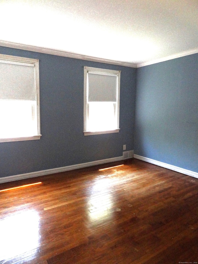 155 Sylvan Knoll Rd, Stamford, CT 06902 - spare room featuring crown molding, wood finished floors, and a textured ceiling