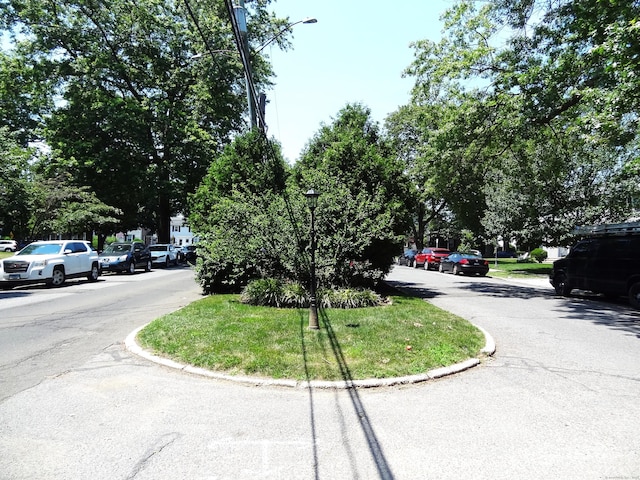 155 Sylvan Knoll Rd, Stamford, CT 06902 - view of asphalt road featuring street lights and curbs