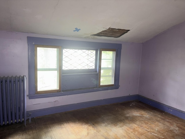607 Broadview Ter, Hartford, CT 06106 - empty room with radiator and wood-type flooring