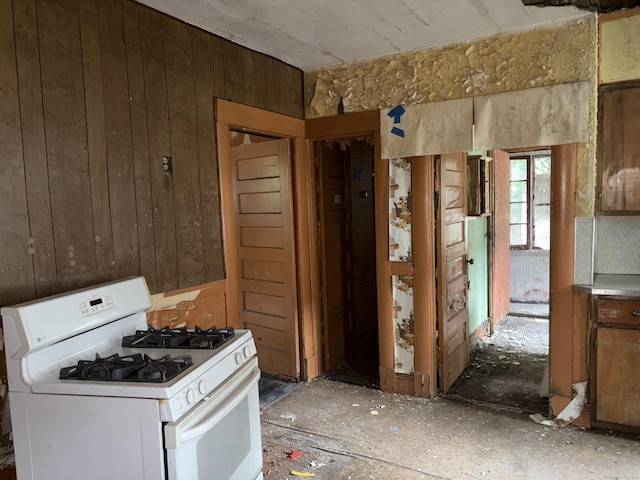 607 Broadview Ter, Hartford, CT 06106 - kitchen featuring white gas stove and wood walls