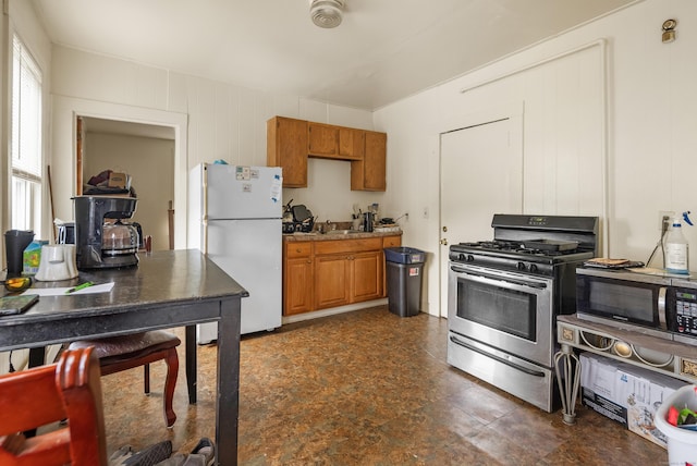 245 Goodrich St, Hamden, CT 06517 - kitchen with stainless steel appliances and brown cabinets