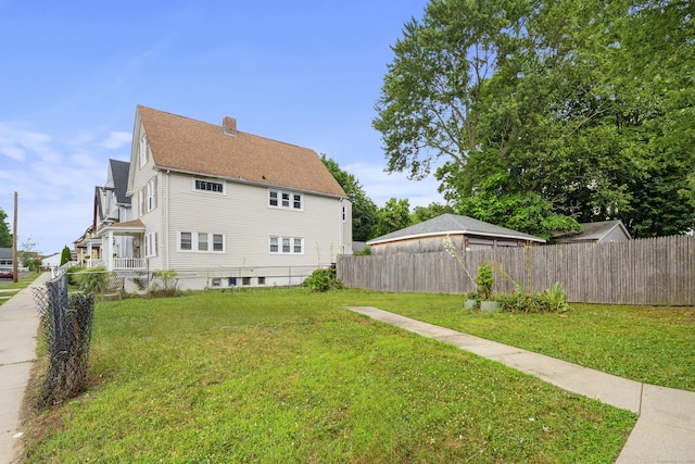 245 Goodrich St, Hamden, CT 06517 - view of home's exterior with a chimney and a shingled roof