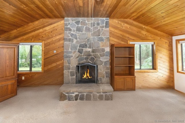 76 Bushy Hill Rd, Deep River, CT 06417 - unfurnished living room with wood walls, wooden ceiling, vaulted ceiling, carpet, and a stone fireplace