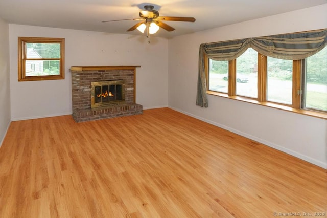 76 Bushy Hill Rd, Deep River, CT 06417 - unfurnished living room with ceiling fan, light wood-style flooring, and a brick fireplace