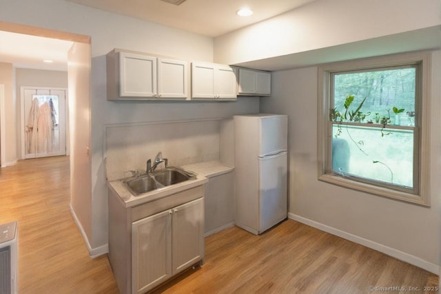76 Bushy Hill Rd, Deep River, CT 06417 - kitchen with freestanding refrigerator, light wood-style floors, light countertops, and recessed lighting