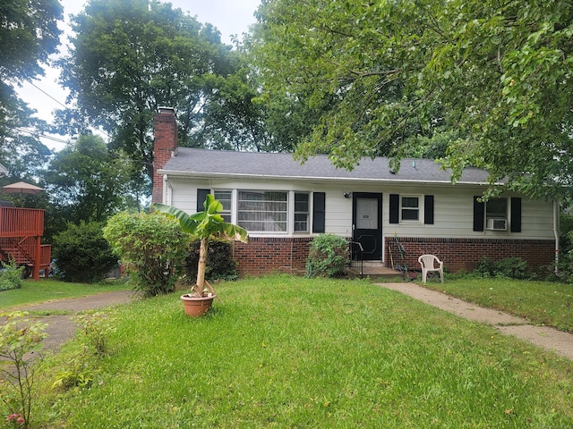 360 Kneeland Rd, New Haven, CT 06512 - view of front of home featuring a front yard, a chimney, and brick siding