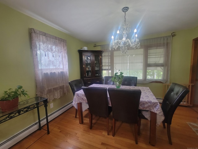 360 Kneeland Rd, New Haven, CT 06512 - dining room with a baseboard radiator, a chandelier, and wood finished floors