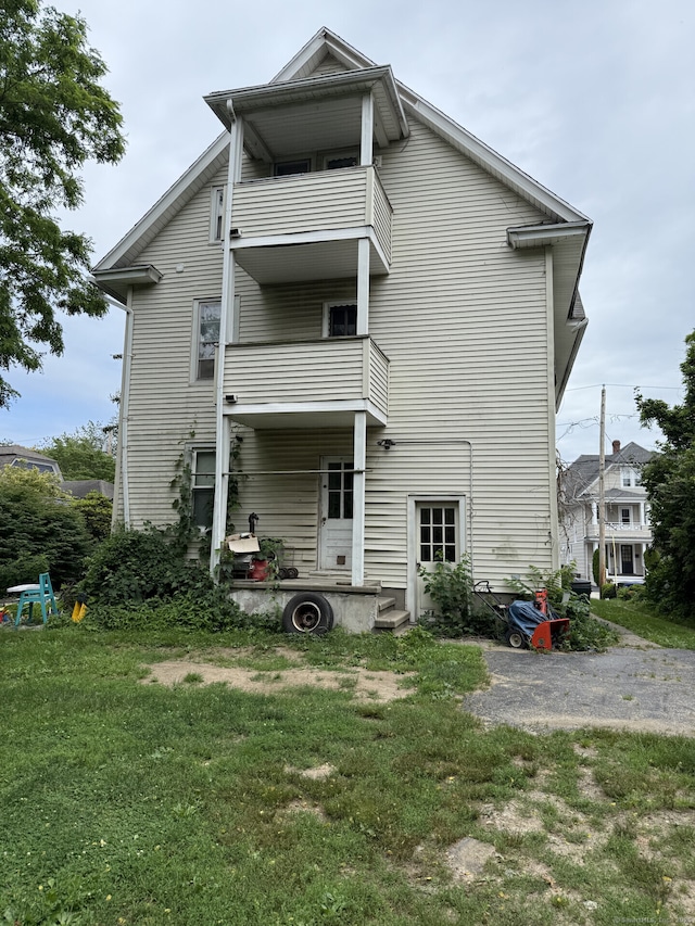 373 Midland St, Bridgeport, CT 06605 - rear view of house with a balcony and a yard