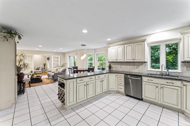 4 Quail Run Dr, Danbury, CT 06811 - kitchen with stainless steel dishwasher, dark countertops, open floor plan, decorative backsplash, and recessed lighting