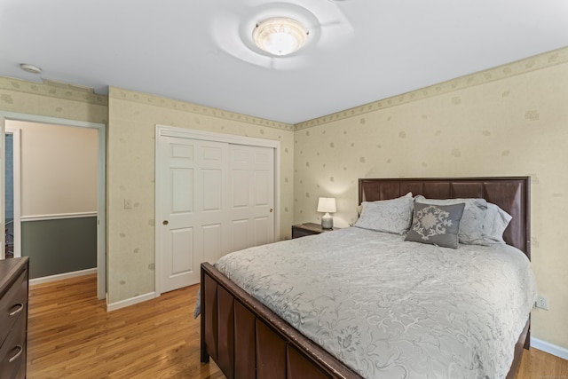 4 Quail Run Dr, Danbury, CT 06811 - bedroom with wallpapered walls, light wood-style floors, and a closet