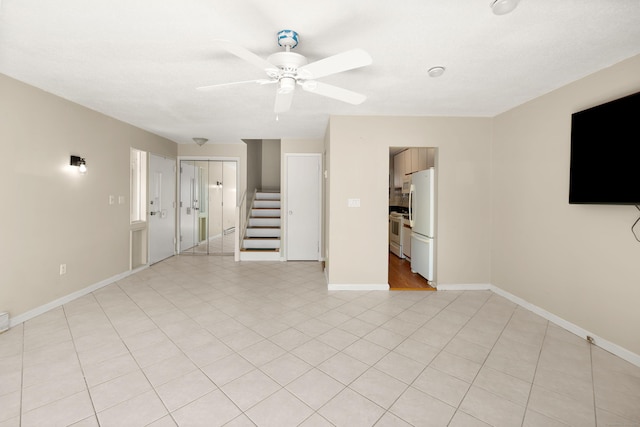 101 W Walk Unit 101, West Haven, CT 06516 - unfurnished living room featuring a ceiling fan and stairs